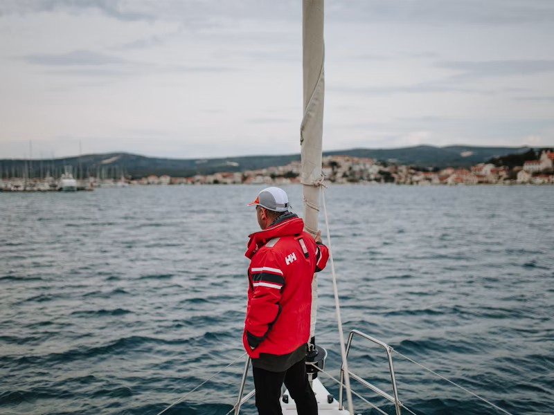 Man in marine jacket on a boat